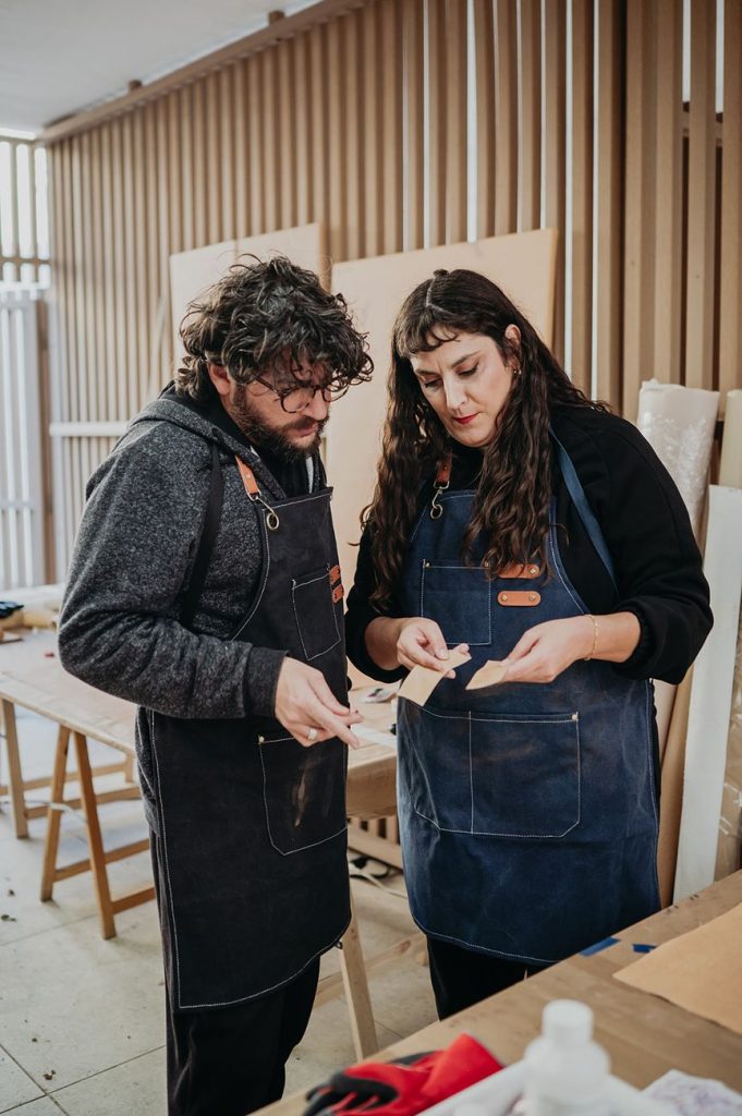Two artists reviewing work together in the studio at the Anfitrión Art Residency, Marbella